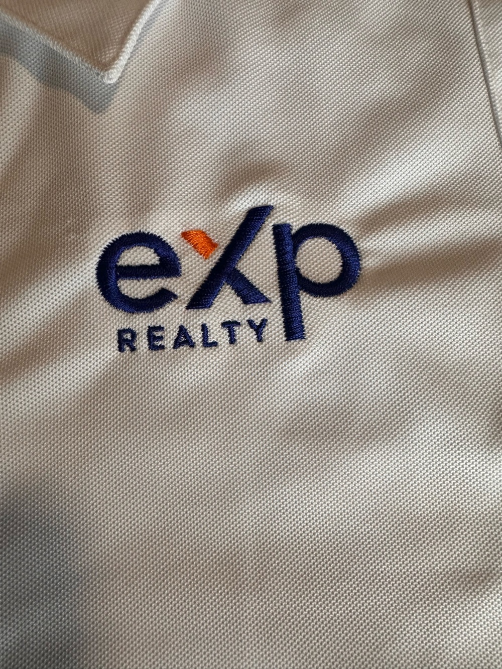 OGIO White Polo with Navy and Orange Embroidered Logo